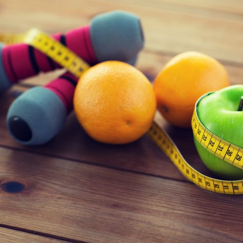 close-up-of-dumbbell-fruits-and-measuring-tape.jpg